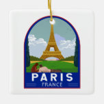 Paris France Retro Travel Art  Keramisch Ornament<br><div class="desc">Ontwerp van de retrorreis van Parijs in een embleemstijl. De Eiffeltoren is een rooster-ijzertoren op de Champ de Mars in Parijs,  Frankrijk.</div>