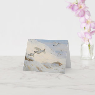 Parmigan in winterverenkleed, vliegend over de sne kaart