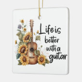 Pas naamgitaar met zonnebloem aan keramisch ornament (Links)