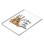 Pas naamgitaar met zonnebloem aan notitieboek (Linkerzijde)