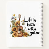 Pas naamgitaar met zonnebloem aan notitieboek (Achterkant)