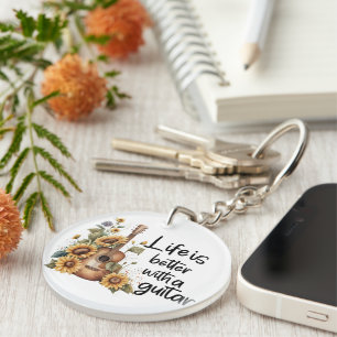 Pas naamgitaar met zonnebloem aan sleutelhanger