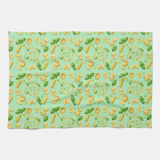 Pasta and basil leaves on green theedoek (Horizontaal)