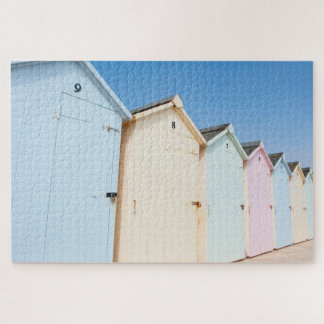 Pastel gekleurde strandhutten legpuzzel