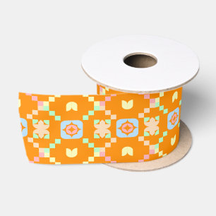 Pastel geometrisch pixelpatroon op levendig oranje satijnen lint