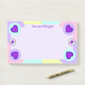 Pastel kleuren & paarse harten kloppen post-it® notes (Op bureau)