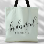 Pastel Mint Bruidsmeisje Modern Script Tote Bag<br><div class="desc">Show uw waardering voor uw bruidsfeest met deze stijlvolle pastel mint groene bruidsmeisje canvas tas. Met modern script en aanpasbaar met de naam van uw bruidsmeisje, deze canvas tas is zowel praktisch als elegant. De zachte kleur en het chique ontwerp maken het perfect voor het dragen van bruiloft dag benodigdheden...</div>