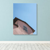 Pastel Pink Colonial Architecture Under a Clear Bl Canvas Afdruk (Insitu (Houten vloer))