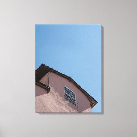 Pastel Pink Colonial Architecture Under a Clear Bl Canvas Afdruk (Voorkant)