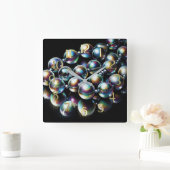 Pastel tekening iriserende kralen op zwart vierkante klok (Huis)