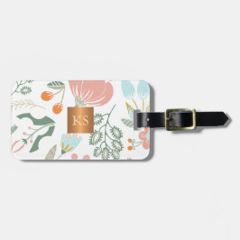 Pastel wilde bloemen met metallisch koper monogram bagagelabel