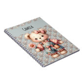 Pastelteddybeer die bloem vasthoudt die overalls d notitieboek (Rechterzijde)