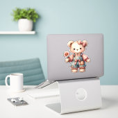 Pastelteddybeer die bloem vasthoudt die overalls d sticker (Laptop op bureau)