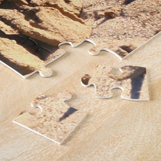 patronen in zand na regen legpuzzel (Zijkant)