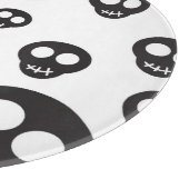 Patroon met zwarte schedels op wit snijplank (Hoek)