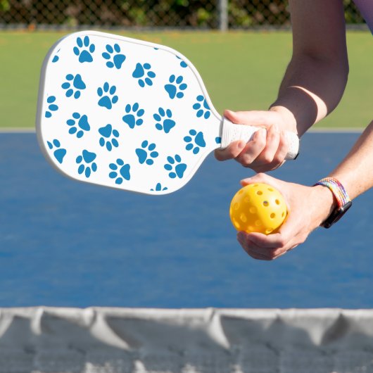Patroon van poten, hondenpoten, blauwe poten pickleball paddle (Insitu)