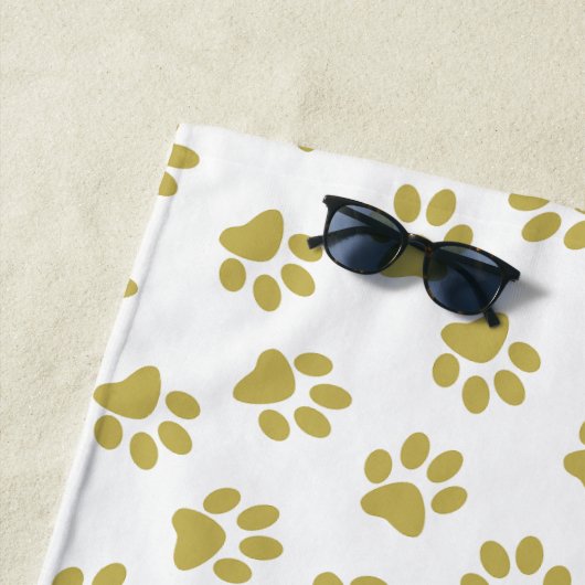 Patroon van poten, hondenpoten, gouden poten strandlaken (In situ)