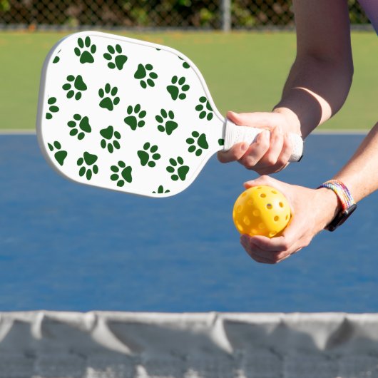 Patroon van poten, hondenpoten, groene poten pickleball paddle (Insitu)
