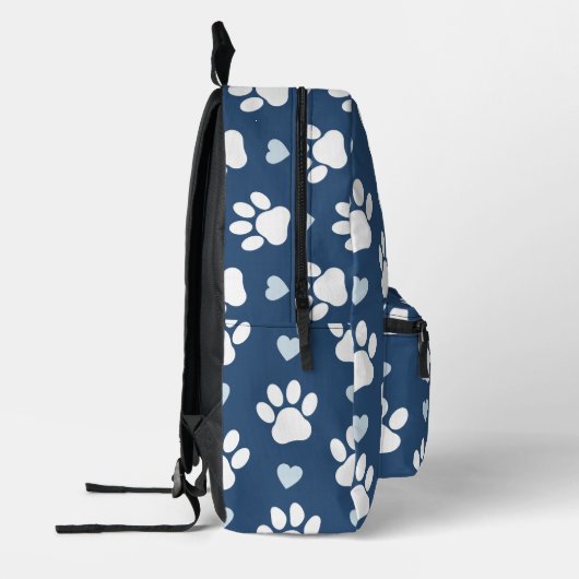 Patroon van poten, reuzenpoten, witte poten, blauw bedrukte rugzak (Links)