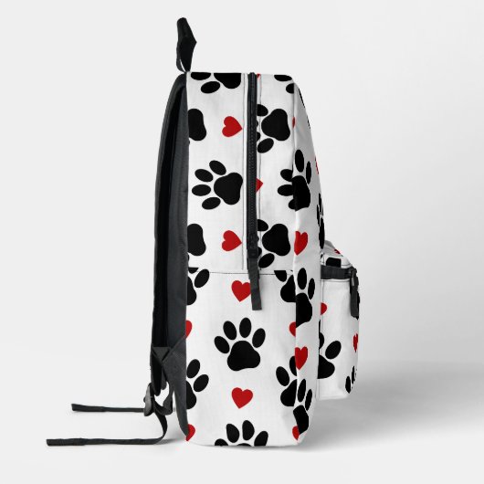 Patroon van poten, reuzenpoten, zwarte poten, rode bedrukte rugzak (Links)