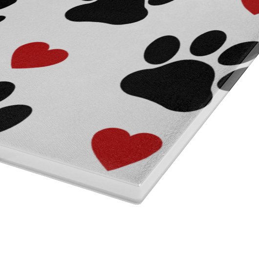 Patroon van poten, reuzenpoten, zwarte poten, rode snijplank (Hoek)