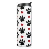 Patroon van poten, reuzenpoten, zwarte poten, rode thermosbeker (Gedraaid links)