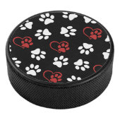 Patroon van poten, witte poten, rode poten, harten hockey puck (3/4)
