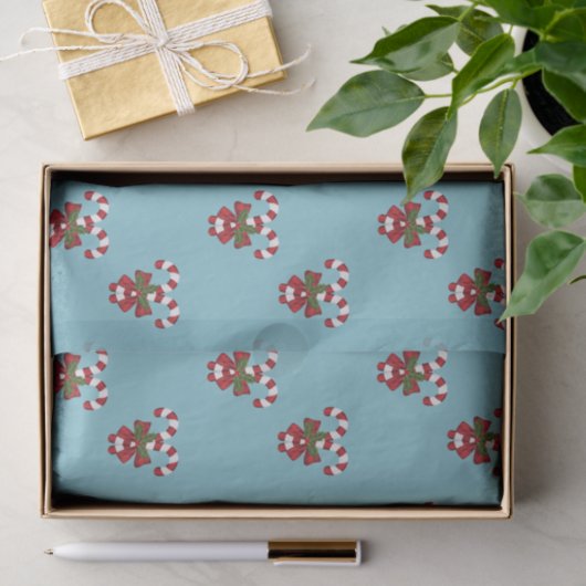 Patroon van twee rode en witte snoepjes op blauw tissuepapier (Geschenk)