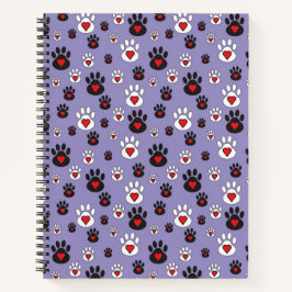 Paw prints met rode harten op blauw notitieboek