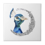 Peacock Silver Glitter Moon Tegeltje<br><div class="desc">Dit is een schilderij van een waterverf van een pauw. De vogel heeft prachtige mengkleuren van blauw en groen. De vogel ziet er erg nobel en trots uit. Er is een faux zilveren glittercirkel rond de vogel.</div>