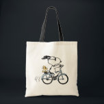 Peanuts | Snoopy & Woodstock Bicycle Tote Bag<br><div class="desc">Pedal into style and classic charm with this adorable cream canvas tote bag, featuring Snoopy and Woodstock on a bicycle! This fun tote showcases a delightful line-art illustration of Snoopy, wearing sunglasses, happily riding a vintage-style blue bicycle with Woodstock perched safely behind him. The dashed lines behind the back wheel...</div>