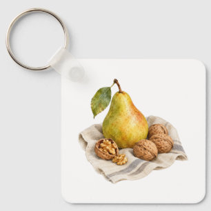 Peer en walnoten op een linnen doek sleutelhanger