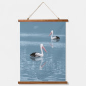 Pelican Couple Paddling op rustig blauw water Hangend Wandkleed (Voorkant)