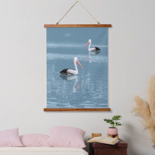 Pelican Couple Paddling op rustig blauw water Hangend Wandkleed