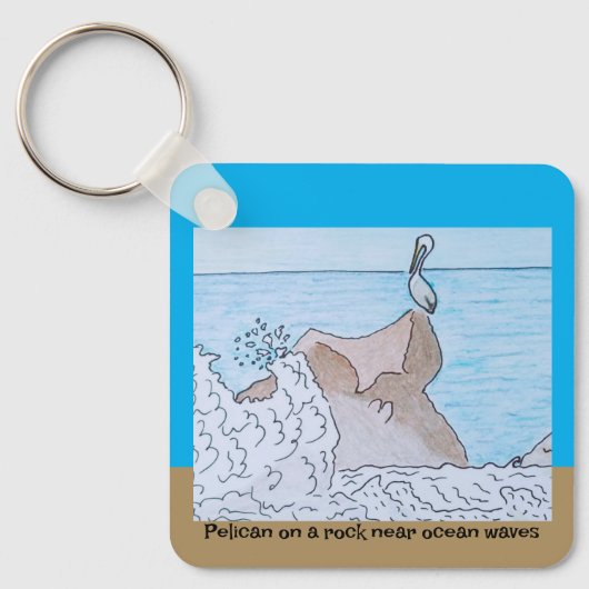 Pelikaan op een rots in de buurt van oceaangolven sleutelhanger (Voorkant)