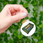 Pennen in een doos sleutelhanger