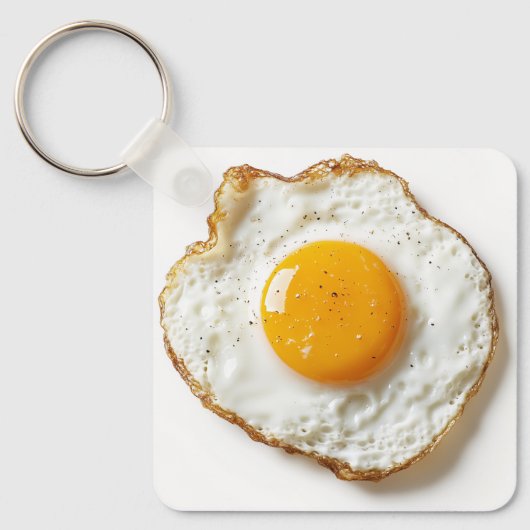 Perfect gebakken ei met scherpe randen en gouden j sleutelhanger (Voorkant)