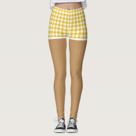 Perfecte benen in moderne gele geruite shorts leggings