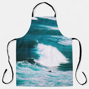 Person surfboard met oceaangolven schort
