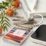 Personalized Book Lover Monogram Sleutelhanger<br><div class="desc">A charming book‑lover keychain featuring a colourful stack of illustrated book spines and a personalized monogram framed in a classic, literary style. Perfect for readers who want to carry a little piece of their bookish world wherever they go, this custom keychain adds warmth and personality to bags, keys, backpacks, and...</div>