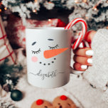Personalized Snowman Koffiemok<br><div class="desc">This custom snowman mug makes the perfect personalized Christmas gift. It features a cute snowman face with your name. This hot chocolate or coffee mug is perfect for your children,  grandkids or friends. Give as a secret Santa or office gift.</div>