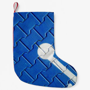 Persoon met een wielketting op een paars wegdek kleine kerstsok