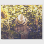 Persoon met wit pet naast zonnebloempitten cadeaupapier (Vlak)