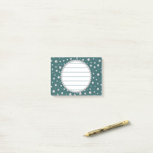 Persoonlijke foto met parels cirkel op turquoise post-it® notes (Op bureau)
