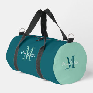 Persoonlijke turquoise reistas met elegante monogr plunjezak