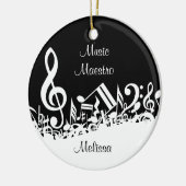 Persoonlijke witte joumloge muzieknotities op zwar keramisch ornament (Links)