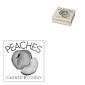 Perziken in het thuisconservenblikveld van perzike rubberstempel (Gestempeld)
