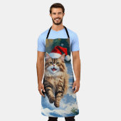 Perzische kat zit in de sneeuw met kerstmuts schort (Gedragen)