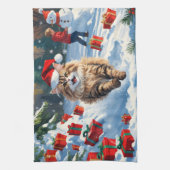 Perzische kat zit in de sneeuw met kerstmuts theedoek (Verticaal)