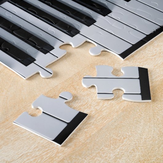 Pianosleutels en muziekboek legpuzzel (Zijkant)